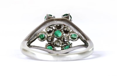 Lot 276 - A silver emerald and diamond cluster ring