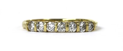 Lot 107 - An 18ct gold diamond half eternity ring