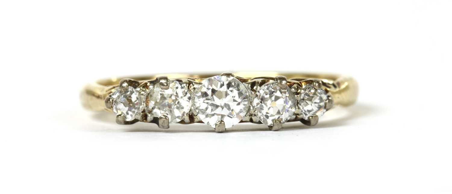 Lot 56 - A gold five stone diamond ring