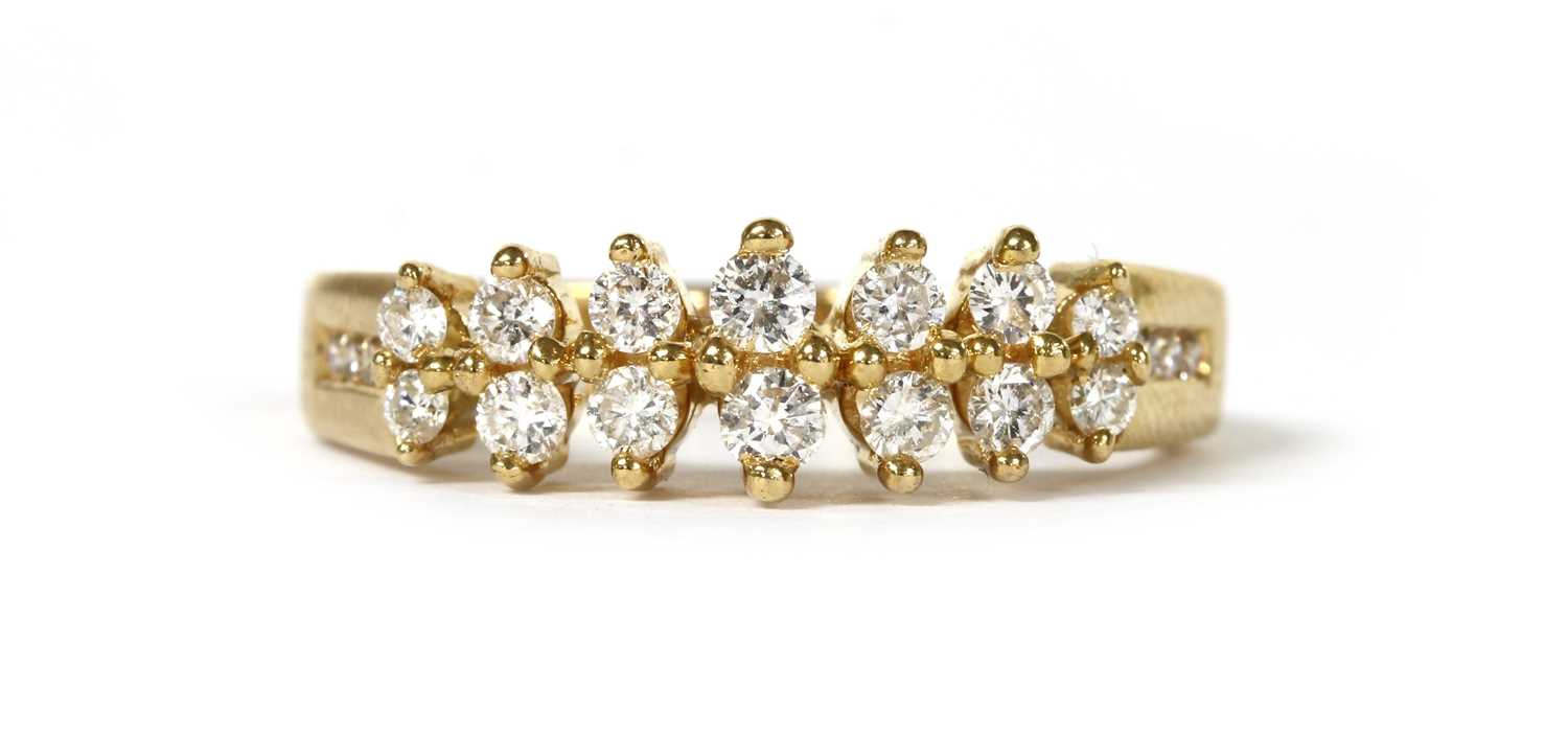 Lot 57 - An 18ct gold two row diamond ring