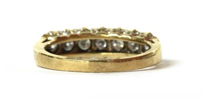 Lot 124 - A 9ct gold seven stone diamond ring
