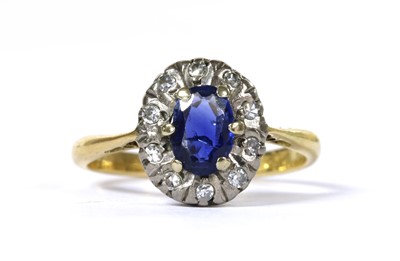 Lot 284 - An 18ct gold sapphire and diamond cluster ring
