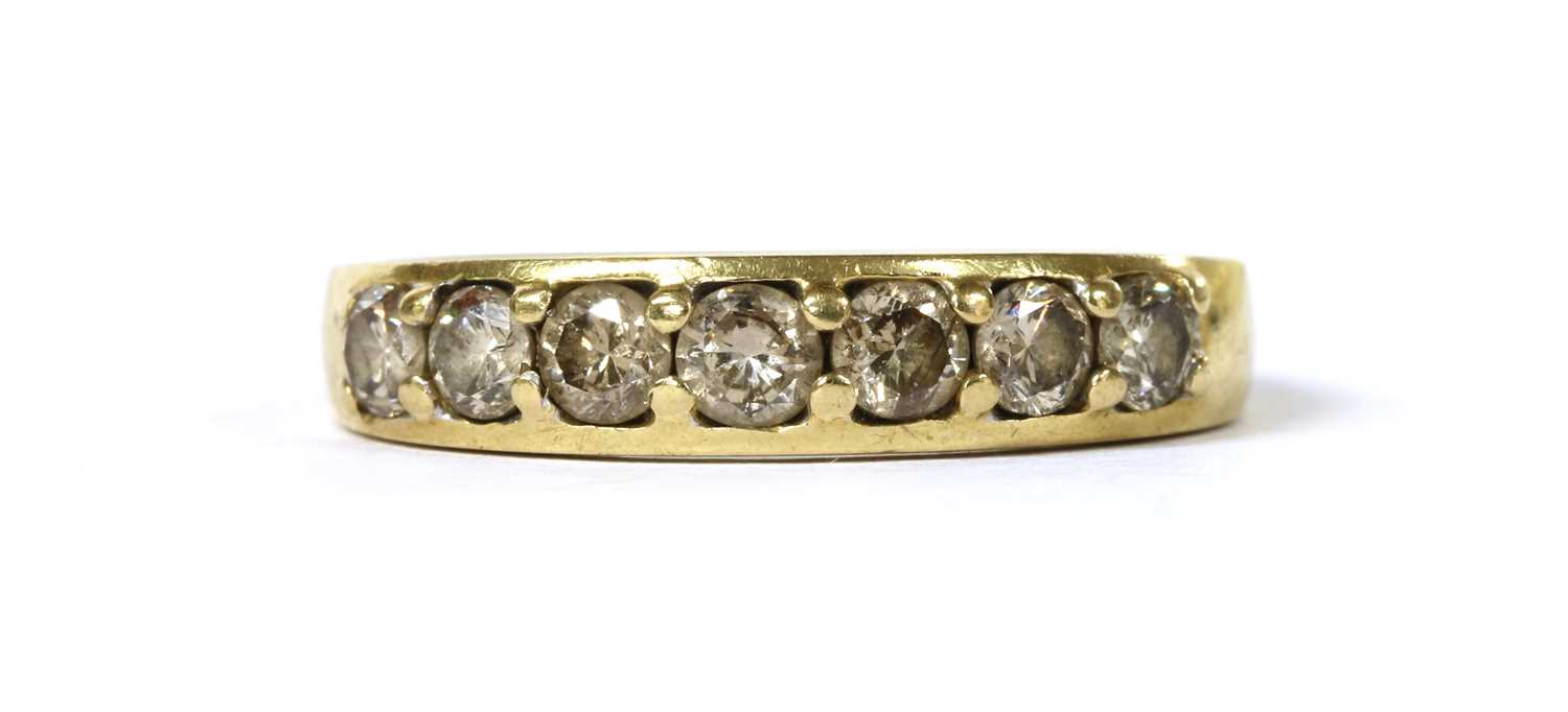 Lot 1104 - A gold seven stone diamond ring