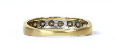 Lot 1104 - A gold seven stone diamond ring