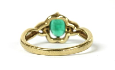 Lot 156 - A 9ct gold emerald and diamond ring