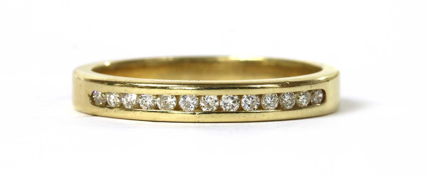 Lot 109 - A gold diamond band ring