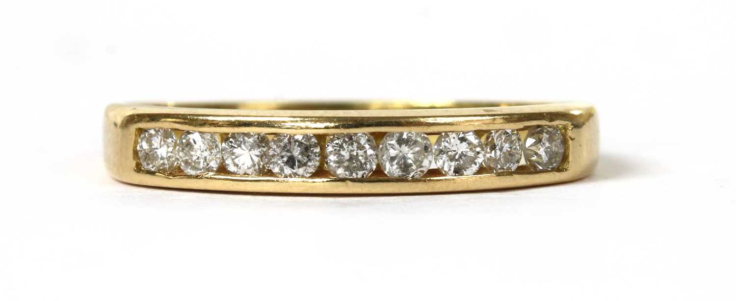 Lot 110 - A gold diamond half eternity ring