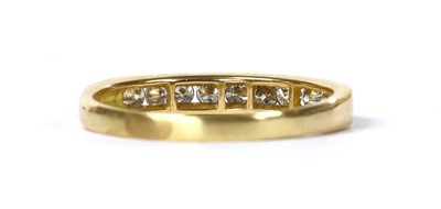 Lot 110 - A gold diamond half eternity ring