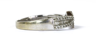 Lot 153 - An 18ct white gold diamond crossover ring