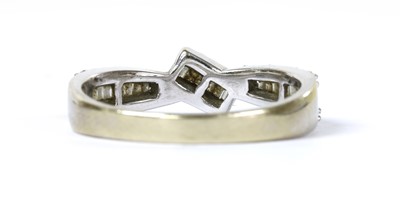 Lot 153 - An 18ct white gold diamond crossover ring