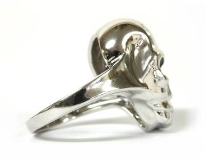 Lot 92 - A 9ct white gold diamond set skull ring