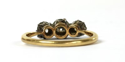 Lot 52 - A gold three stone diamond ring