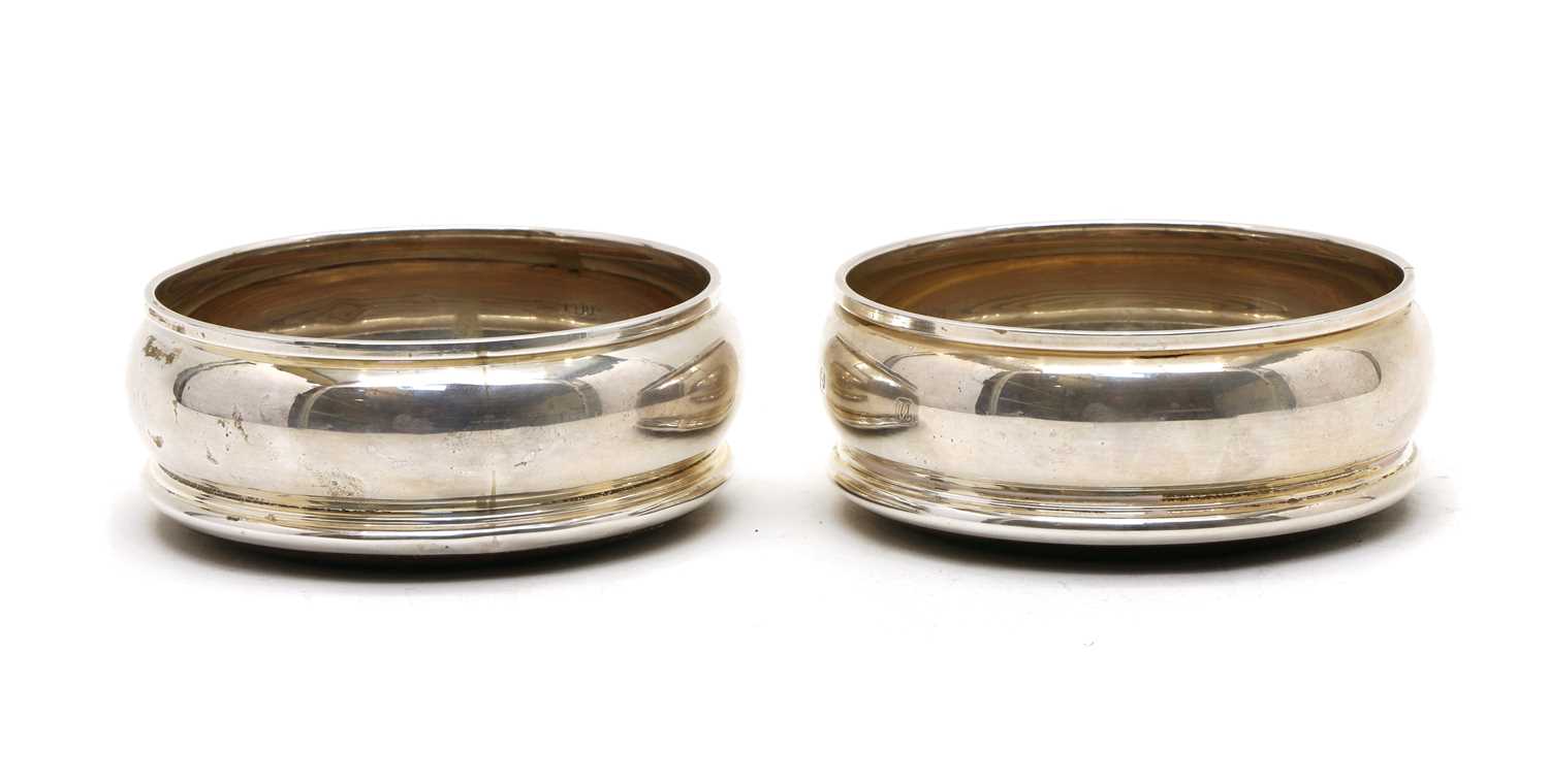 Lot 5 - A pair of silver coasters