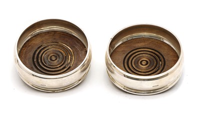 Lot 5 - A pair of silver coasters