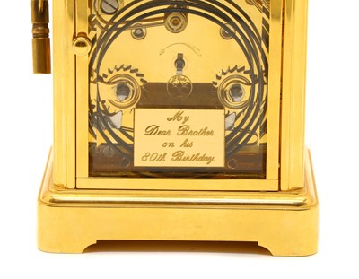 Lot 143 - A lacquered brass carriage clock