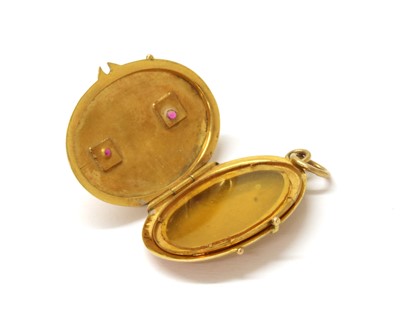 Lot 222 - A gold ruby set locket