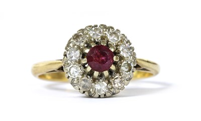 Lot 218 - A gold ruby and diamond cluster ring
