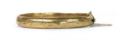 Lot 195 - A 9ct gold hollow oval bangle