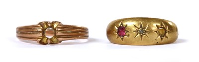 Lot 384 - An 18ct gold diamond and ruby ring