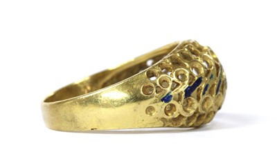 Lot 77 - A gold enamel pierced ring