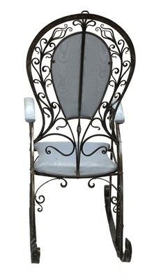 Lot 637 - The 'Peacock' iron rocking chair