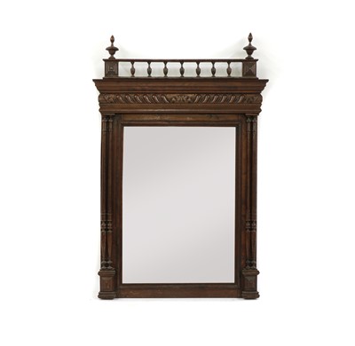 Lot 304 - A 19th century Continental oak wall mirror