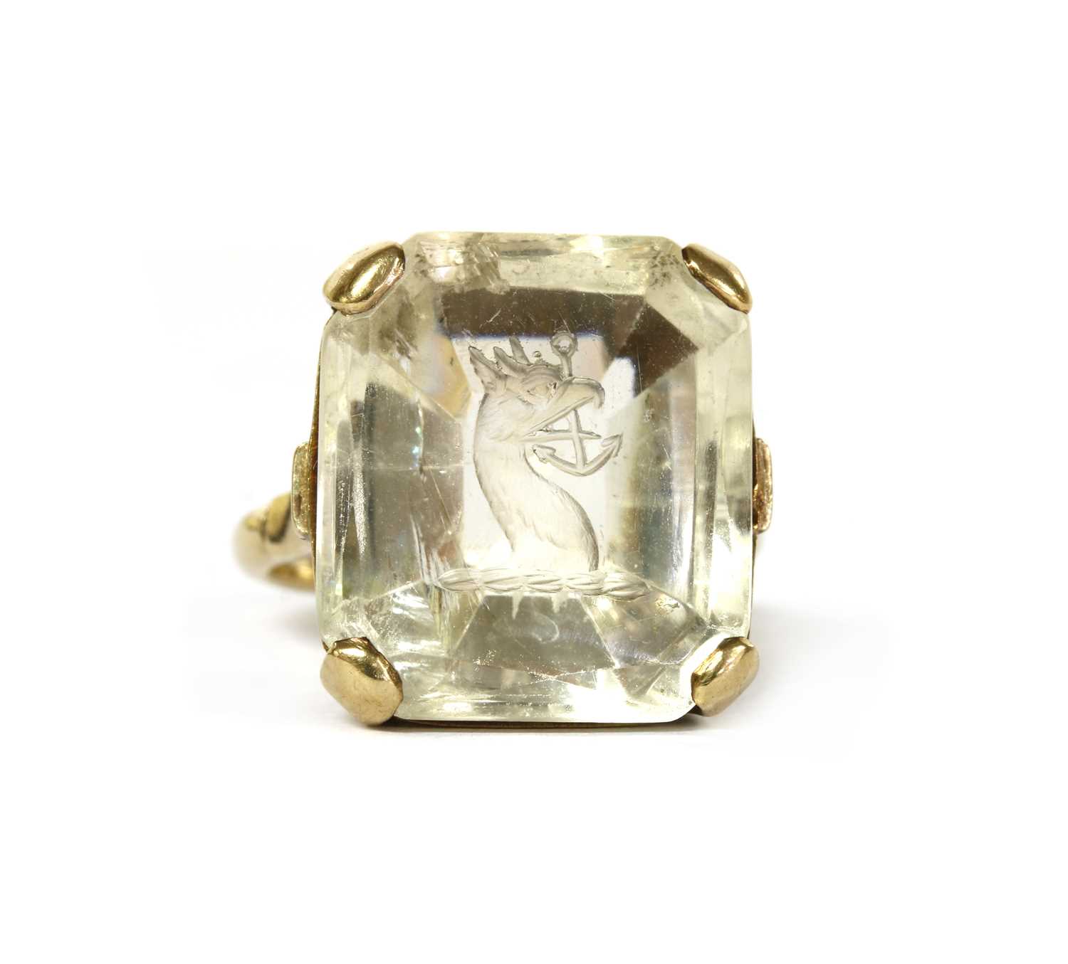 Lot 1037 - A gold intaglio engraved smoky quartz ring