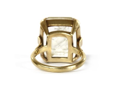 Lot 1037 - A gold intaglio engraved smoky quartz ring