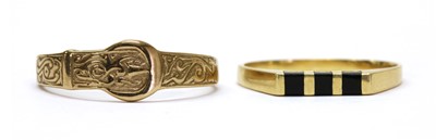 Lot 389 - A 9ct gold engraved buckle ring