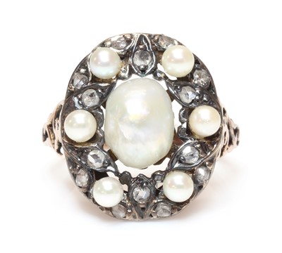 Lot 314 - An oriental cultured freshwater pearl, cultured pearl and diamond oval cluster ring