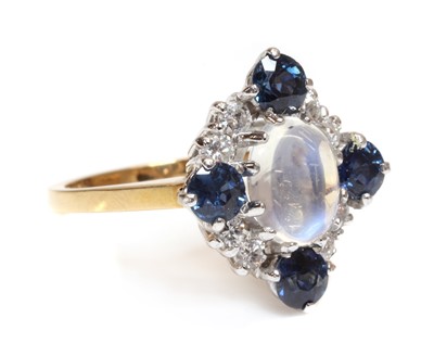 Lot 457 - An 18ct gold moonstone, sapphire and diamond, lozenge shaped cluster ring, c.1970