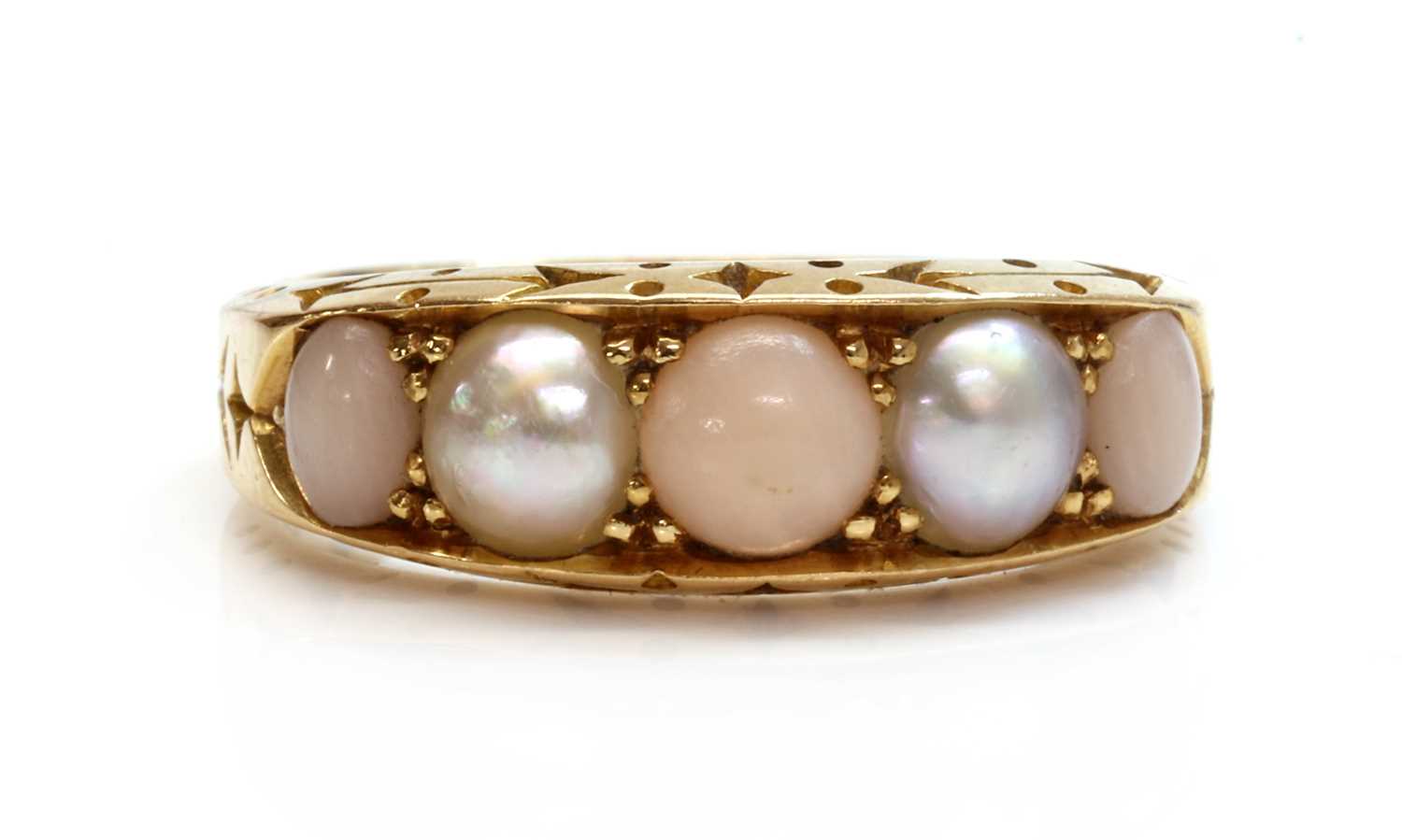 Lot 144 - A late Victorian five stone coral and split pearl boat shaped ring