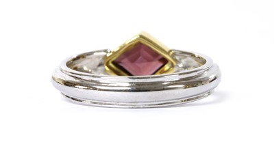 Lot 1248 - A two colour gold single stone garnet ring