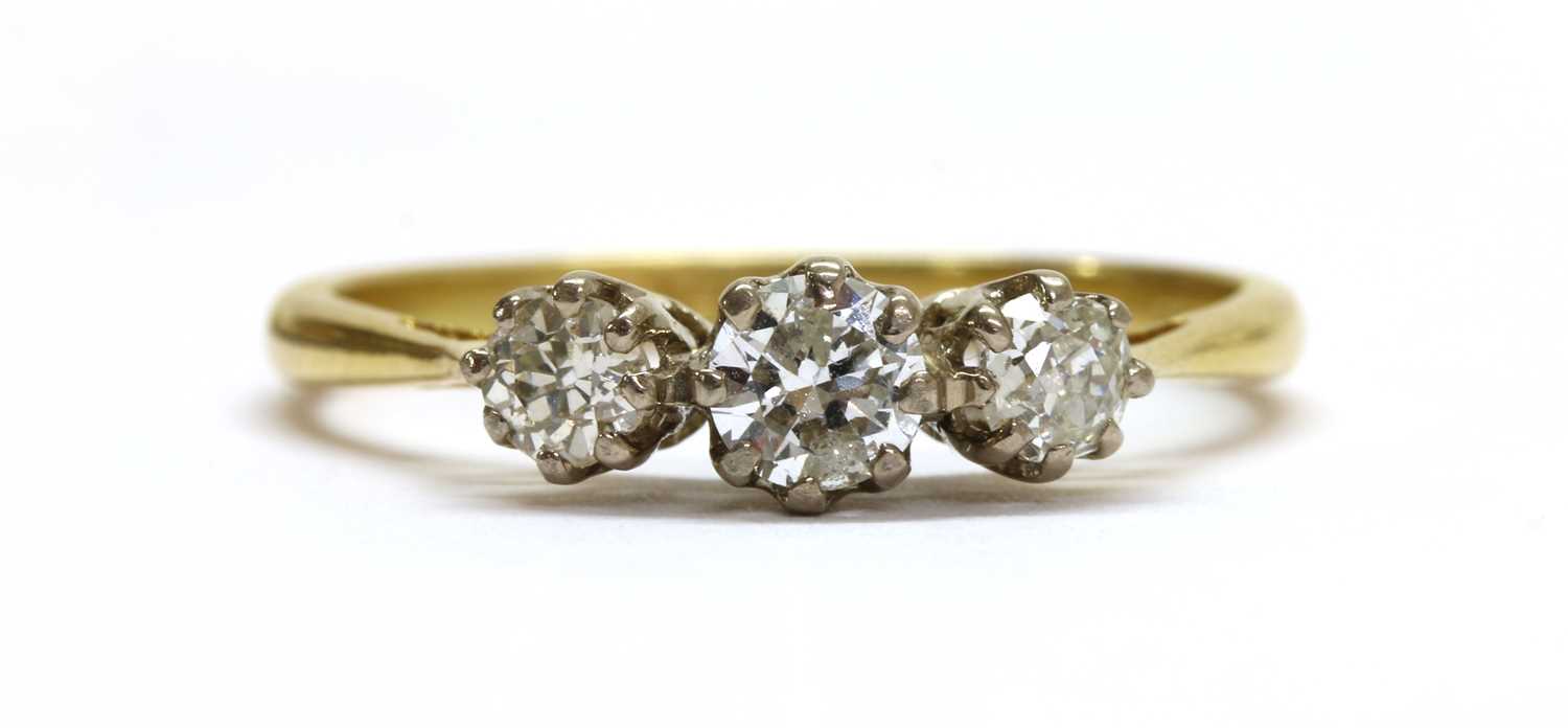 Lot 98 - An 18ct gold three stone diamond ring