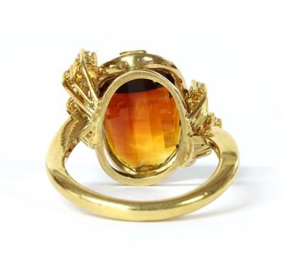 Lot 1159 - A German 18ct gold citrine and diamond ring