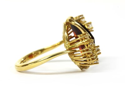 Lot 1159 - A German 18ct gold citrine and diamond ring