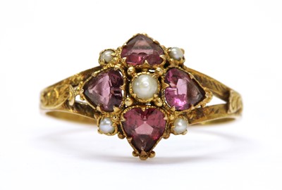 Lot 10 - A Victorian 15ct gold garnet and split pearl ring