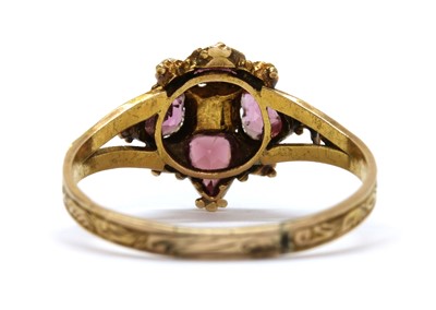Lot 10 - A Victorian 15ct gold garnet and split pearl ring