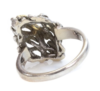 Lot 289 - An 18ct yellow and white gold diagonal lozenge shaped domed head ring, c.1970