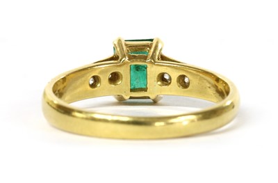 Lot 1192 - An 18ct gold emerald and diamond ring