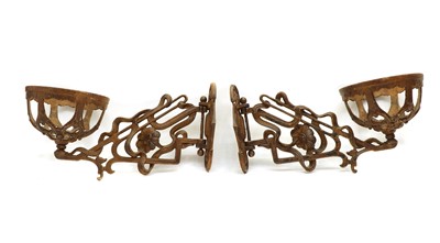 Lot 39 - A pair of wrought iron wall planters of scroll form