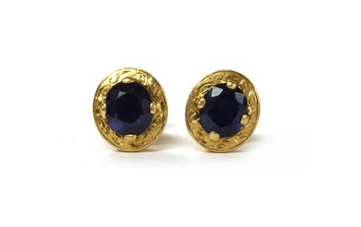 Lot 1220 - A pair of 14ct gold single stone sapphire stud earrings