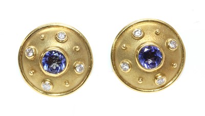 Lot 464 - A pair of 18ct gold tanzanite and diamond circular shield form earrings