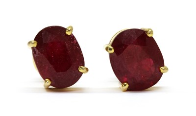 Lot 1146 - A pair of gold fracture filled ruby stud earrings