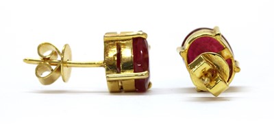 Lot 1146 - A pair of gold fracture filled ruby stud earrings