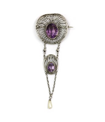 Lot 1055 - A silver Arts and Crafts amethyst and dog tooth pearl brooch, c.1910