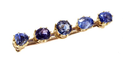 Lot 103 - A five stone sapphire bar brooch