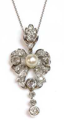 Lot 82 - An early 20th century pearl and diamond cartouche shaped pendant