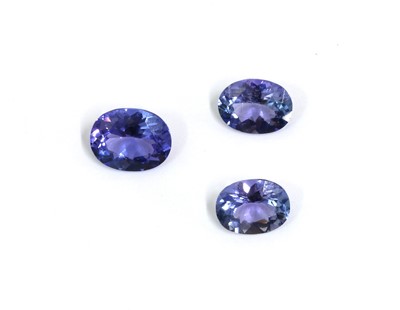 Lot 1402 - Three unmounted oval mixed cut tanzanites