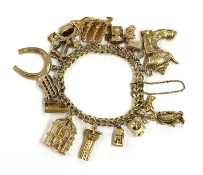 Lot 199 - A gold charm bracelet
